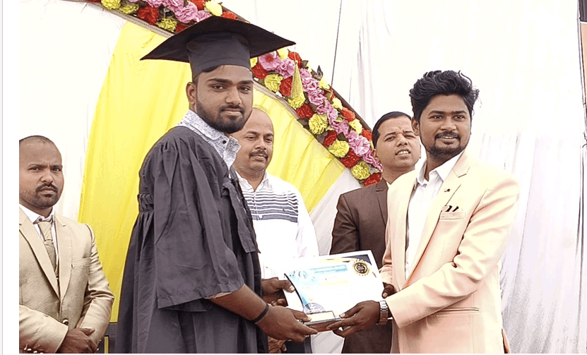 Graduate student receiving diploma certificate and trophy on stage