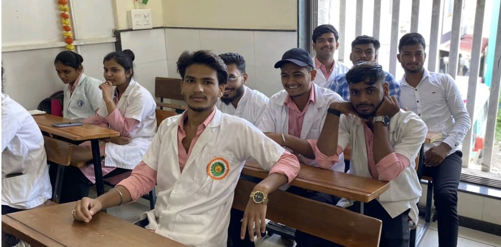 Students wearing Independence Day badges at desk